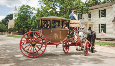 Family in a horse drawn carriage
