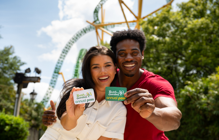 Man and woman holding Busch Gardens Tampa Bay annual passes