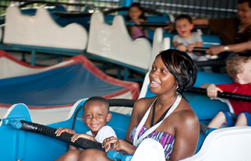 A child and an adult on Elephant Run at Busch Gardens Williamsburg