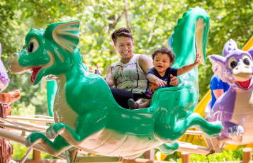 An adult and child riding Flutter Sputter at Busch Gardens Williamsburg