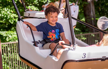 A boy on a balloon theme park ride